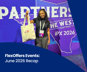 A FlexOffers representative smiles and holds a tote in at iPX 2026 in Austin, Texas.